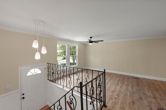 2442 E Devine, Tyler, TX 75701 - entrance foyer with a ceiling fan, wood finished floors, crown molding, and baseboards