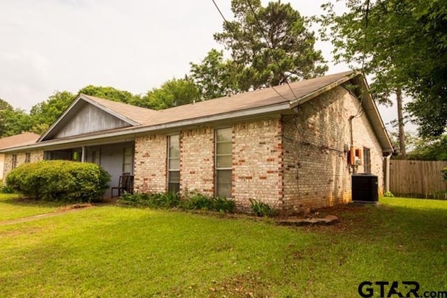 304 Blake Dr, Longview, TX 75604 - view of home's exterior featuring brick siding and a central AC unit