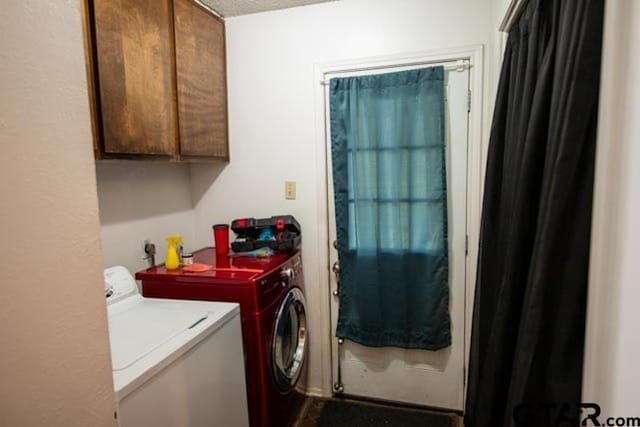 304 Blake Dr, Longview, TX 75604 - washroom with washer and clothes dryer and cabinet space