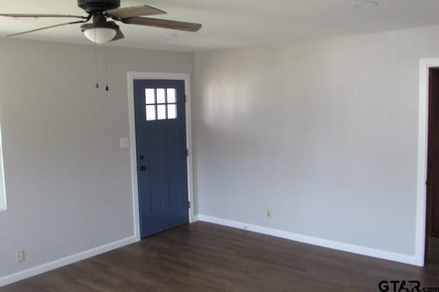 foyer featuring dark wood finished floors, baseboards, and ceiling fan