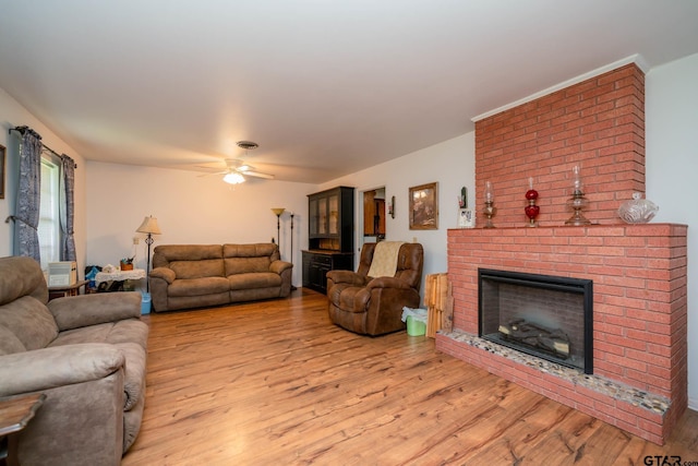 126 Jordan, Rusk, TX 75785 - living room featuring a fireplace, light wood-style flooring, and a ceiling fan