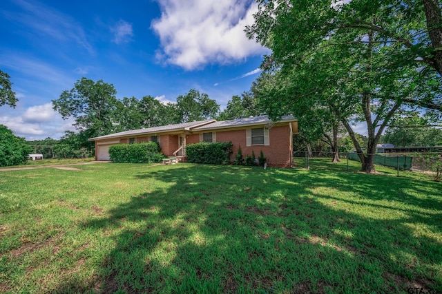 126 Jordan, Rusk, TX 75785 - ranch-style home with an attached garage and brick siding