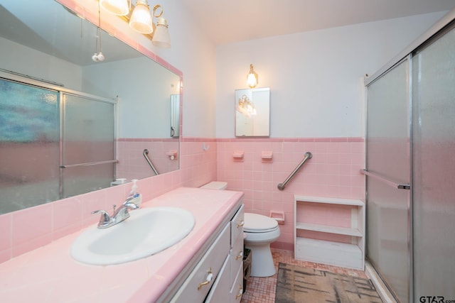 126 Jordan, Rusk, TX 75785 - full bath with vanity, tile walls, a stall shower, a wainscoted wall, and tile patterned floors