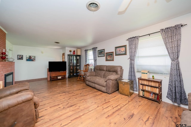 126 Jordan, Rusk, TX 75785 - living room with wood-type flooring, a brick fireplace, and ceiling fan