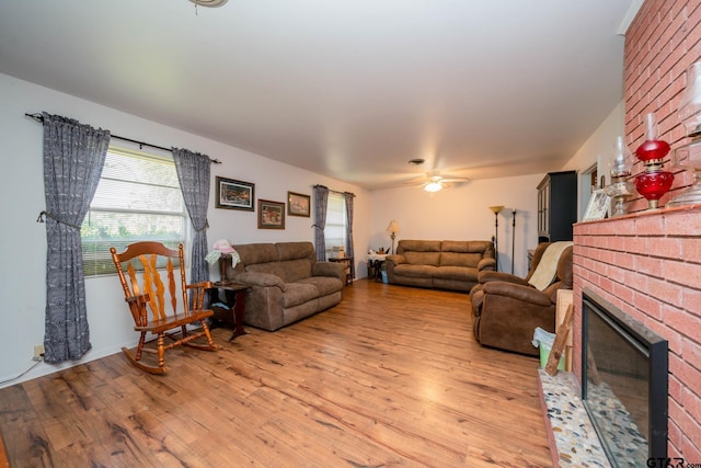 126 Jordan, Rusk, TX 75785 - living area featuring light wood-style flooring, a brick fireplace, and a ceiling fan