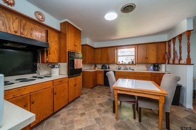 126 Jordan, Rusk, TX 75785 - kitchen with black appliances, stone finish flooring, brown cabinetry, and light countertops