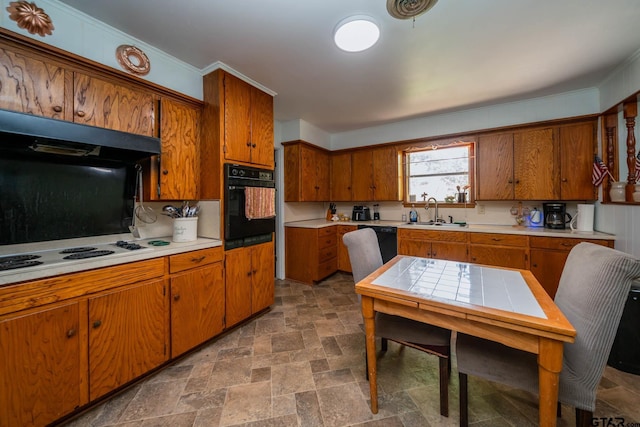 126 Jordan, Rusk, TX 75785 - kitchen with black appliances, stone finish flooring, brown cabinetry, light countertops, and under cabinet range hood