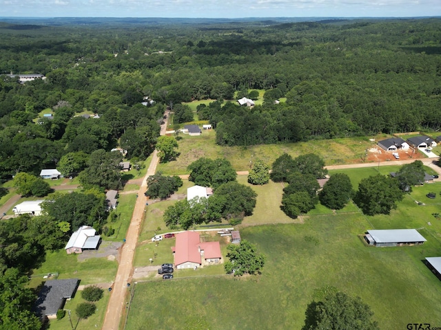 126 Jordan, Rusk, TX 75785 - aerial view of property and surrounding area featuring a heavily wooded area
