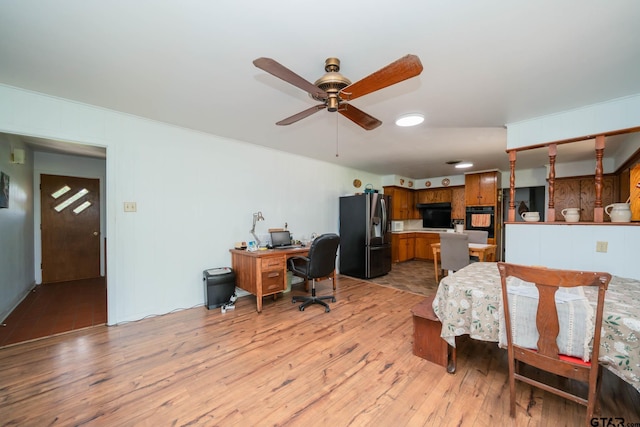 126 Jordan, Rusk, TX 75785 - bedroom featuring refrigerator with ice dispenser, light wood-style floors, and an office area