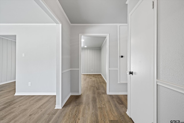 2014 Miller Dr, Tyler, TX 75701 - hallway with wood finished floors, ornamental molding, and baseboards