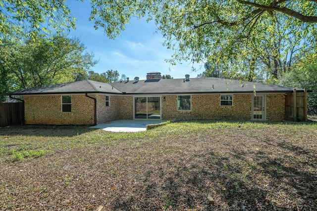 2014 Miller Dr, Tyler, TX 75701 - back of property with a patio area and brick siding