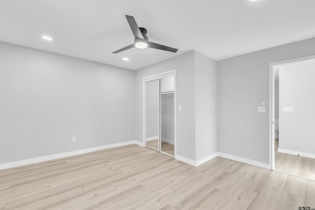 unfurnished bedroom with light wood finished floors, baseboards, a ceiling fan, a closet, and recessed lighting