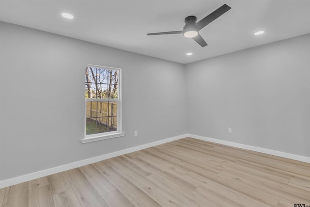 unfurnished room featuring ceiling fan, recessed lighting, wood finished floors, and baseboards