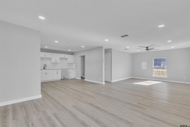 unfurnished living room with ceiling fan, light wood-style flooring, recessed lighting, visible vents, and baseboards