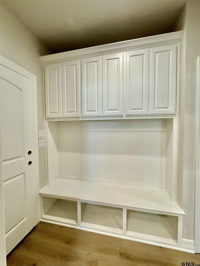 mudroom featuring dark wood-style floors
