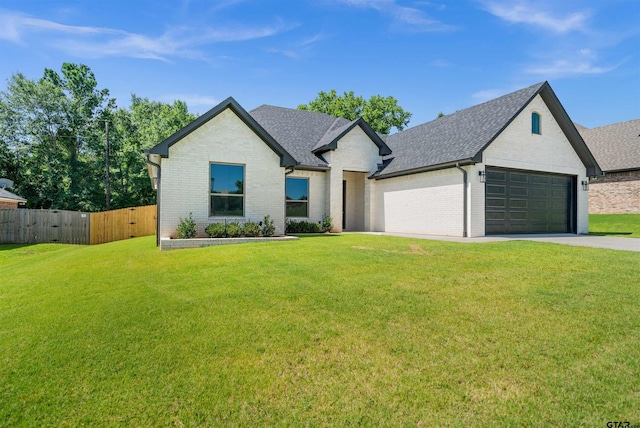 1838 Rocky Mtn, Tyler, TX 75703 - french country inspired facade featuring brick siding, roof with shingles, a garage, and concrete driveway