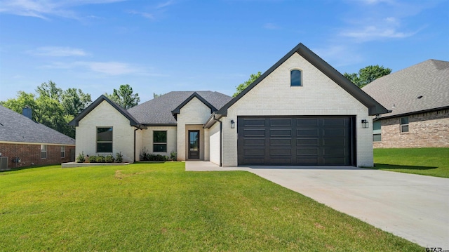 1838 Rocky Mtn, Tyler, TX 75703 - french country home featuring driveway, brick siding, a front yard, and a garage