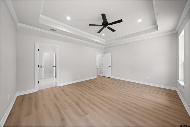 1838 Rocky Mtn, Tyler, TX 75703 - unfurnished bedroom with a raised ceiling, ornamental molding, light wood-style floors, recessed lighting, and connected bathroom