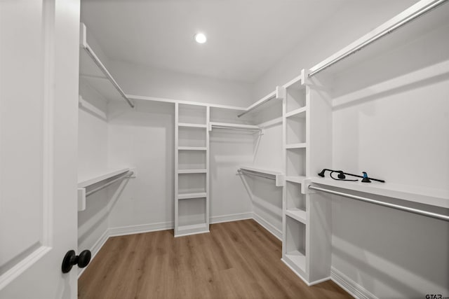 1838 Rocky Mtn, Tyler, TX 75703 - walk in closet featuring wood finished floors