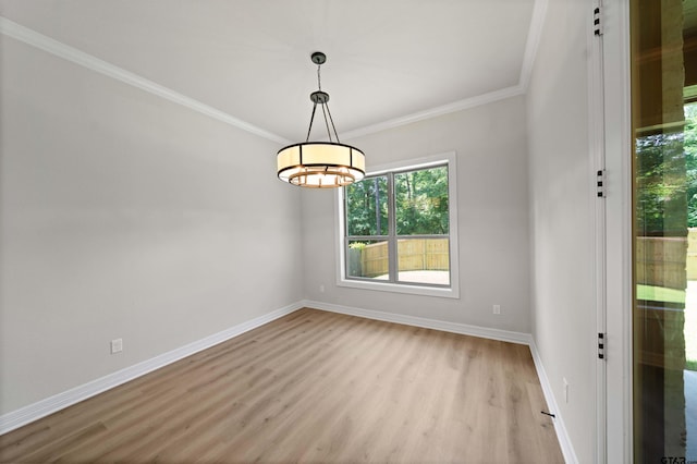 1838 Rocky Mtn, Tyler, TX 75703 - empty room with light wood finished floors, crown molding, and a chandelier