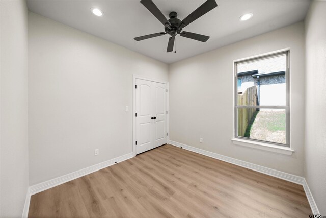 1838 Rocky Mtn, Tyler, TX 75703 - spare room featuring light wood-style floors, recessed lighting, and a ceiling fan