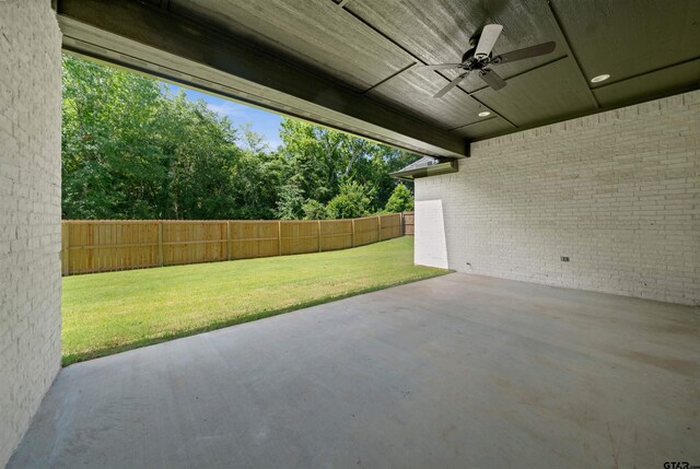 1838 Rocky Mtn, Tyler, TX 75703 - fenced backyard with a ceiling fan and a patio