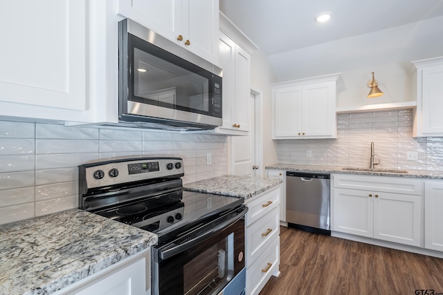 kitchen featuring white cabinetry, sink, dark hardwood / wood-style floors, and appliances with stainless steel finishes