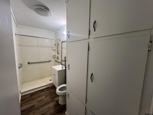 201 First St, Naples, TX 75568 - full bath with wood finished floors, a shower, toilet, and vanity