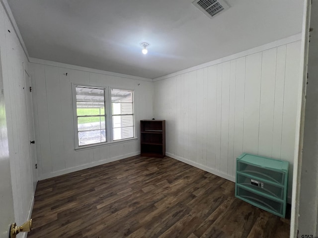 201 First St, Naples, TX 75568 - spare room featuring dark wood-style floors, baseboards, and ornamental molding