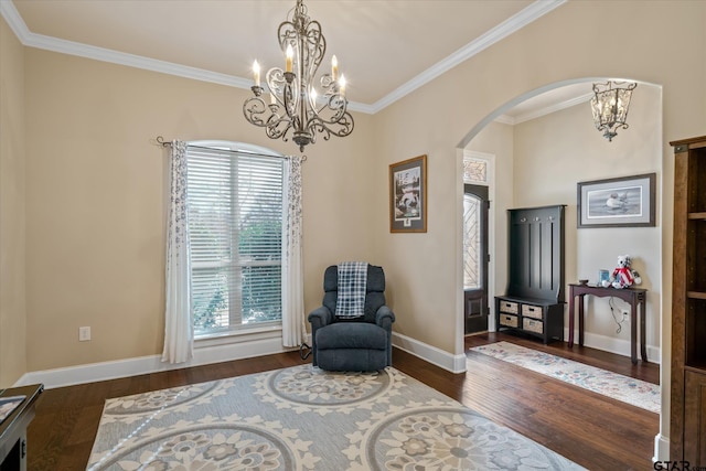 sitting room with dark wood-style floors, baseboards, and an inviting chandelier