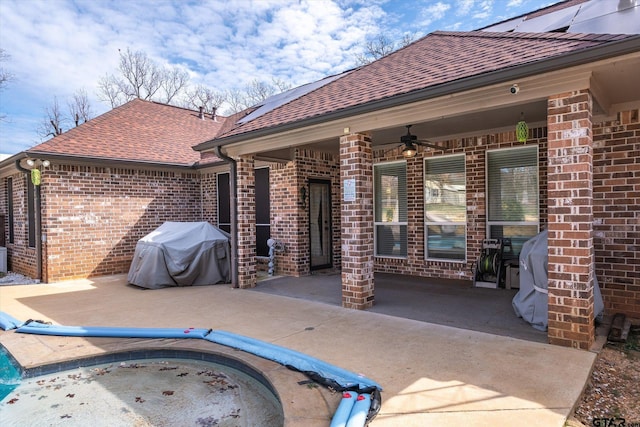 view of patio / terrace with area for grilling and a ceiling fan