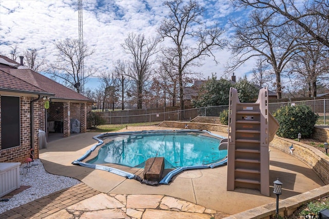 view of pool featuring a fenced in pool, a patio area, and a fenced backyard