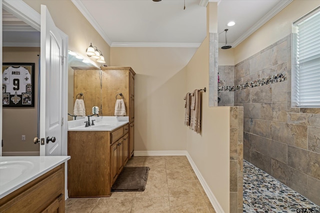 bathroom with baseboards, tile patterned floors, crown molding, a walk in shower, and two vanities