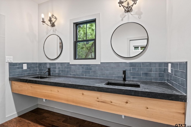 1509 Panther Creek Pass, Mount Vernon, TX 75457 - bathroom with decorative backsplash, double vanity, and wood finished floors