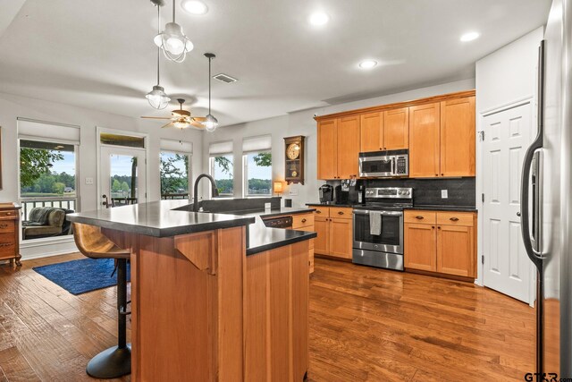 1509 Panther Creek Pass, Mount Vernon, TX 75457 - kitchen featuring appliances with stainless steel finishes, dark countertops, healthy amount of natural light, ceiling fan, and recessed lighting
