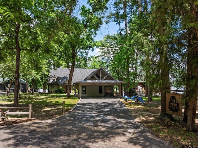 1509 Panther Creek Pass, Mount Vernon, TX 75457 - view of front facade with asphalt driveway and a carport