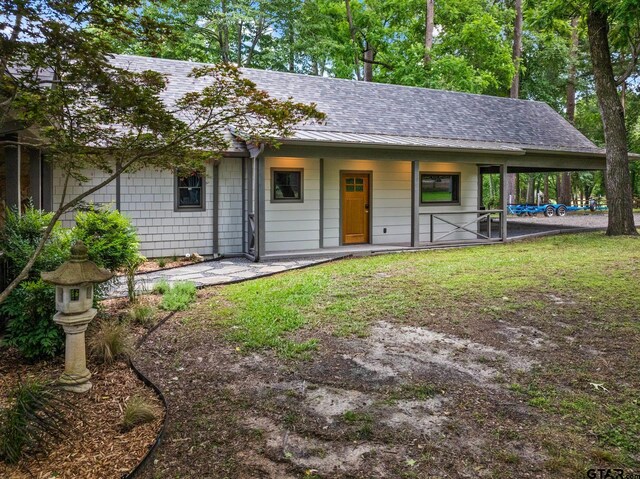 1509 Panther Creek Pass, Mount Vernon, TX 75457 - view of front of home featuring roof with shingles and covered porch