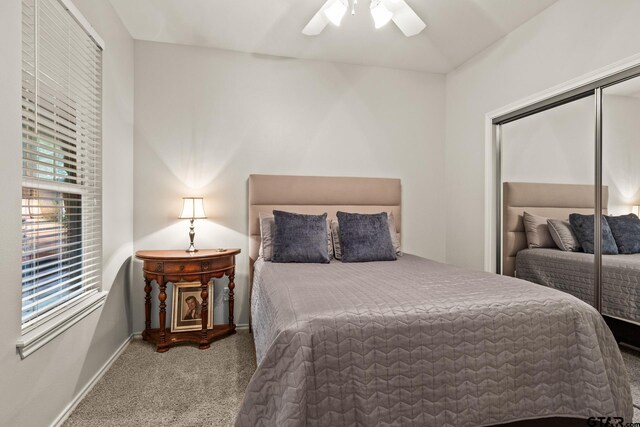 1509 Panther Creek Pass, Mount Vernon, TX 75457 - bedroom featuring carpet flooring, baseboards, a closet, and a ceiling fan