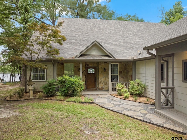 1509 Panther Creek Pass, Mount Vernon, TX 75457 - ranch-style house featuring roof with shingles, a front yard, and a porch