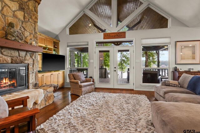 1509 Panther Creek Pass, Mount Vernon, TX 75457 - living room with a fireplace, lofted ceiling, dark wood-style floors, and french doors