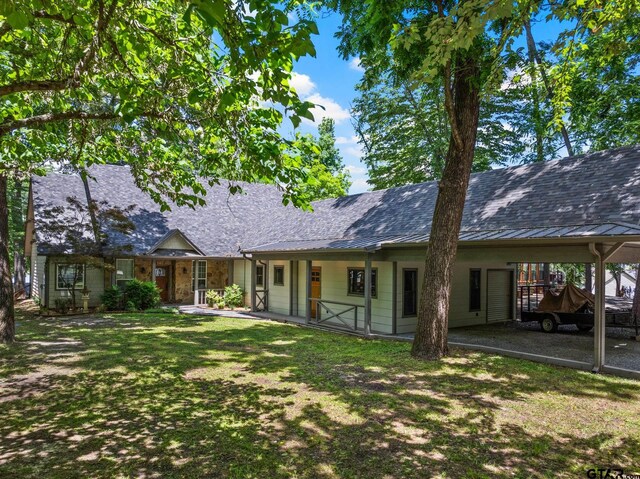 1509 Panther Creek Pass, Mount Vernon, TX 75457 - back of property featuring a carport