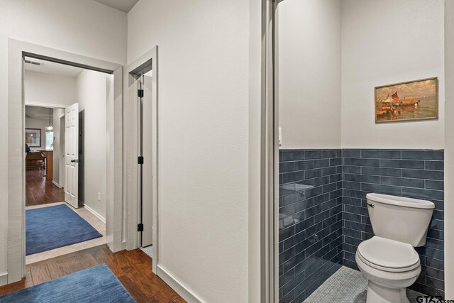 1509 Panther Creek Pass, Mount Vernon, TX 75457 - bathroom featuring wood finished floors and toilet