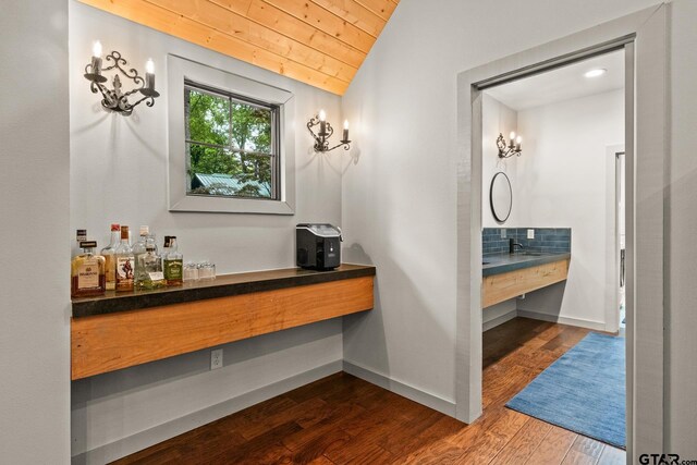 1509 Panther Creek Pass, Mount Vernon, TX 75457 - bathroom with wood ceiling, vaulted ceiling, wood finished floors, vanity, and baseboards