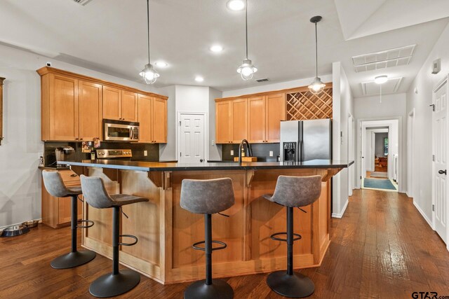 1509 Panther Creek Pass, Mount Vernon, TX 75457 - kitchen featuring appliances with stainless steel finishes, dark wood-style flooring, dark countertops, baseboards, and recessed lighting