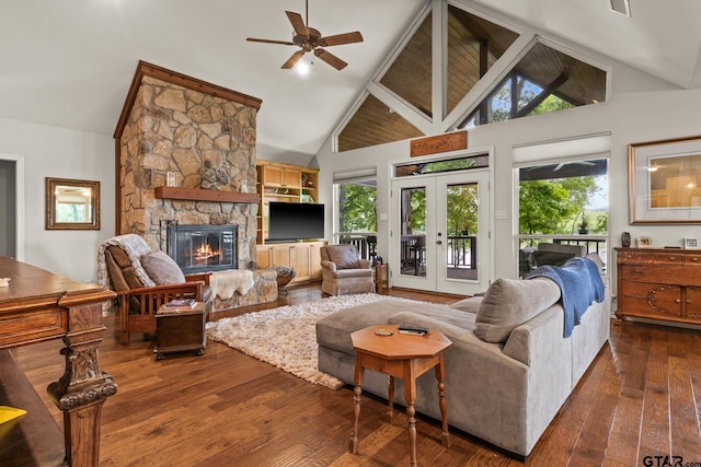 1509 Panther Creek Pass, Mount Vernon, TX 75457 - living area featuring high vaulted ceiling, healthy amount of natural light, a stone fireplace, dark wood finished floors, and ceiling fan