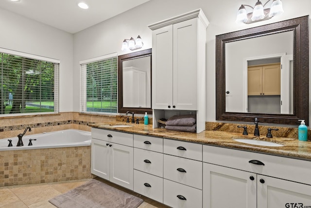 1509 Panther Creek Pass, Mount Vernon, TX 75457 - bathroom featuring double vanity, a bath, tile patterned floors, and recessed lighting