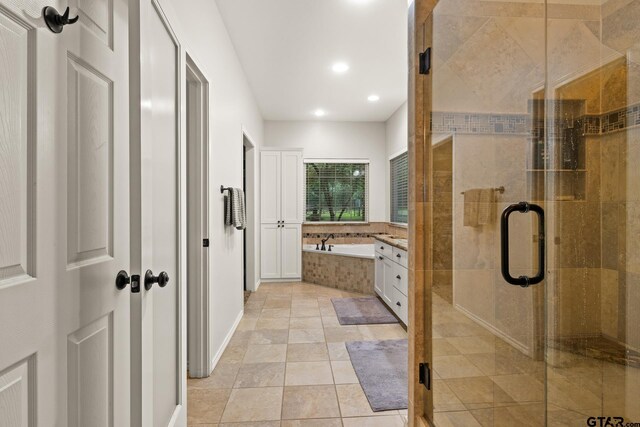 1509 Panther Creek Pass, Mount Vernon, TX 75457 - bathroom with a garden tub, a stall shower, recessed lighting, baseboards, and vanity