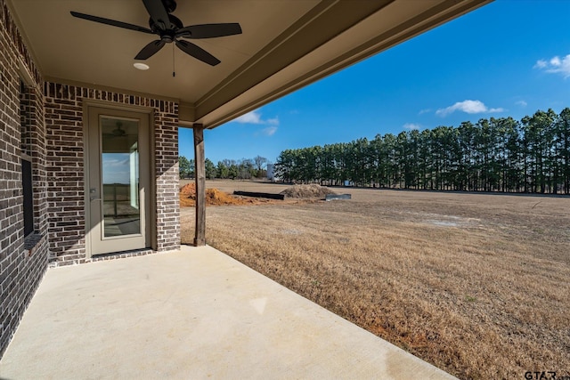 view of patio featuring ceiling fan