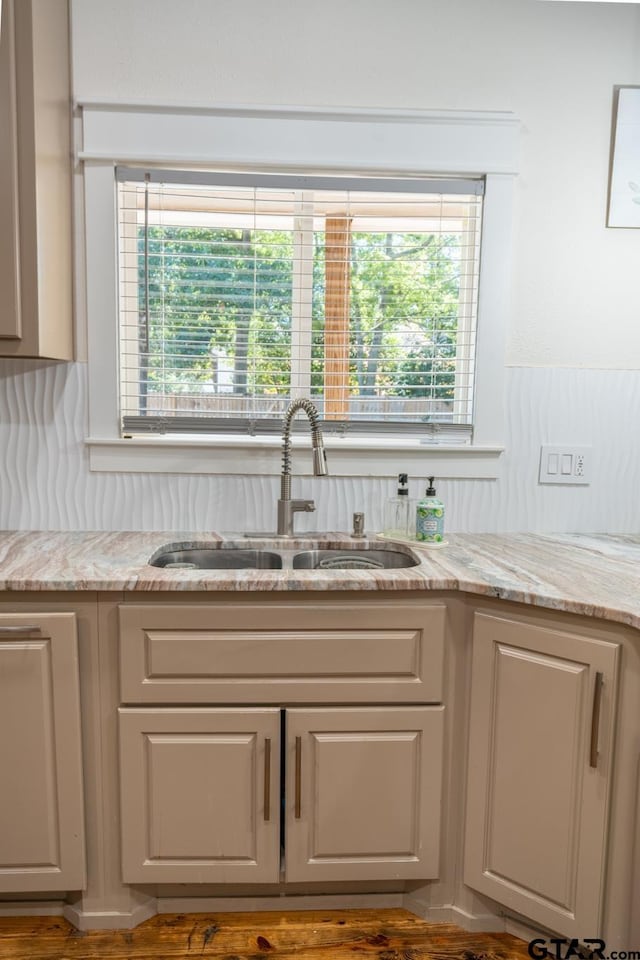 200 W Van St, Lindale, TX 75771 - kitchen featuring a sink, light stone countertops, and decorative backsplash