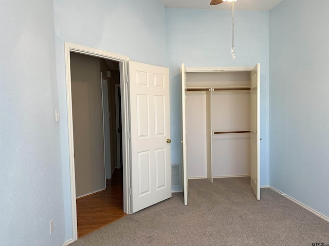 unfurnished bedroom with carpet floors and a closet